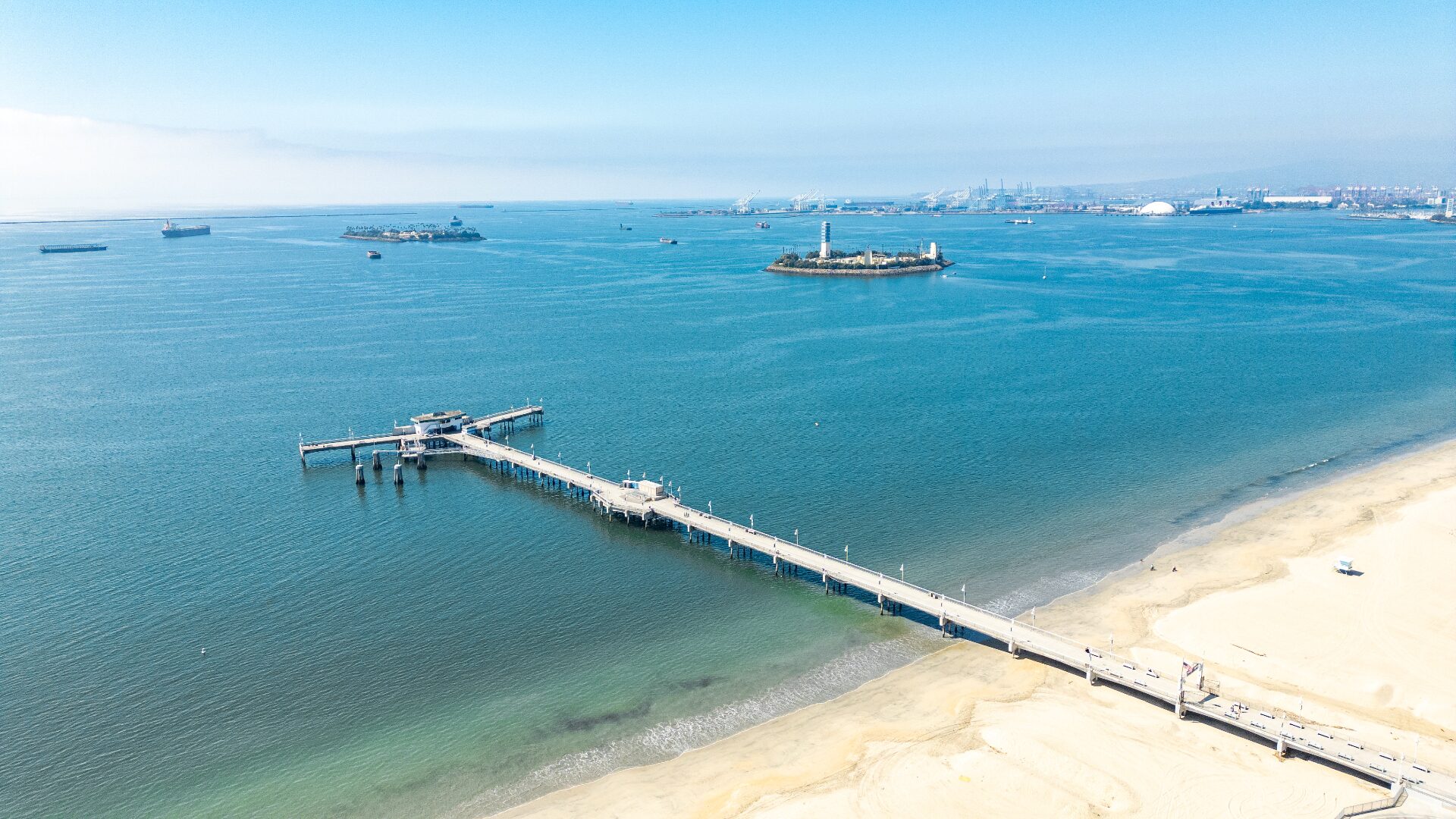 Aerial view of Belmont Pier reaching into the Pacific Ocean near 226 Grand Ave