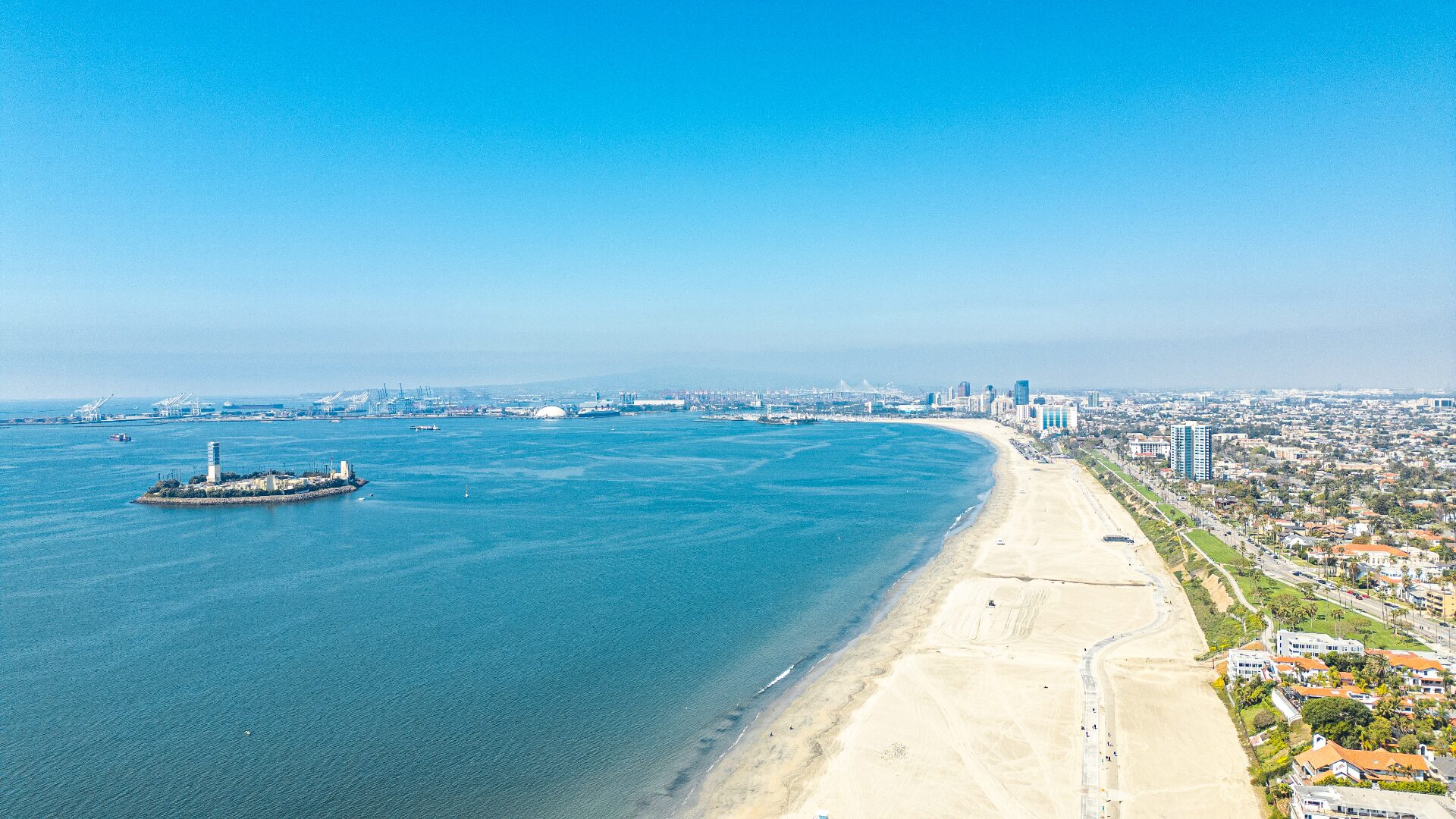 Sweeping aerial panorama of Long Beach shoreline, harbor, and downtown skyline from 226 Grand Ave